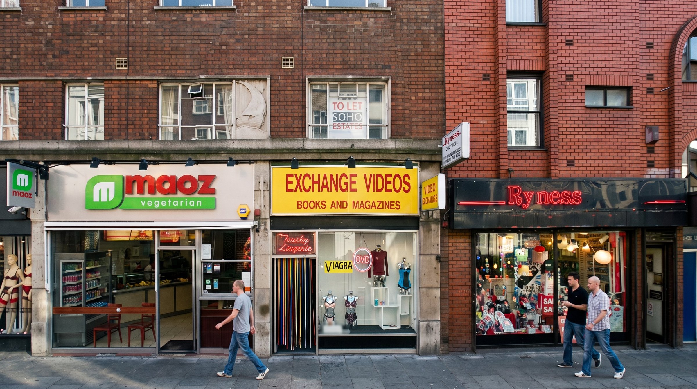 Maoz, Exchange Videos and Ryness on Old Compton Street, a Soho Estates To Let board in the window above.